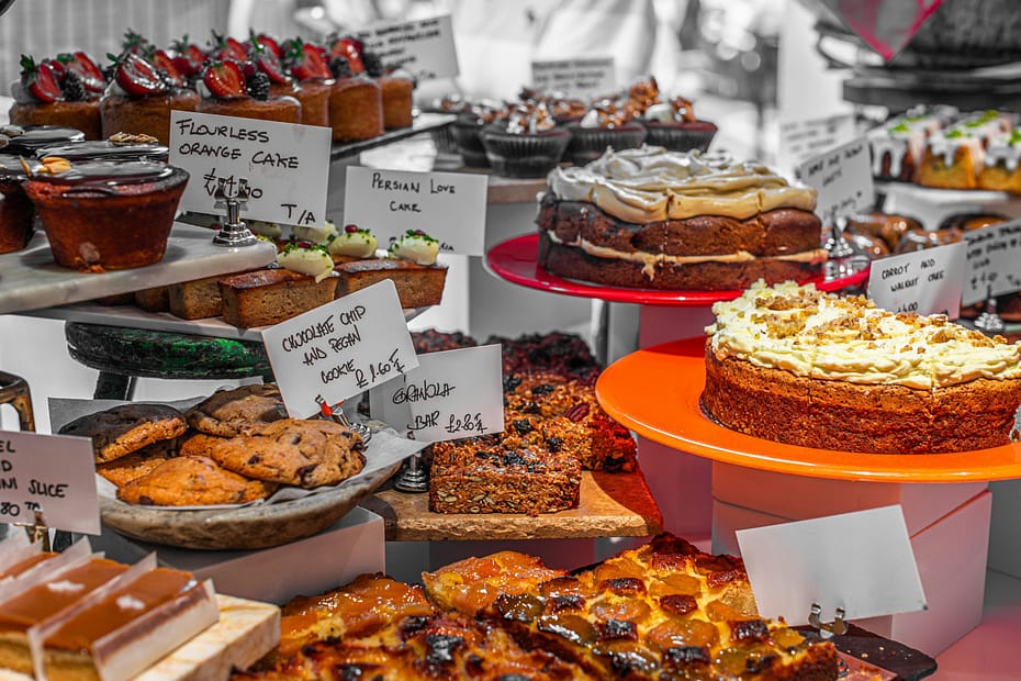 A table filled with lots of different types of cakes